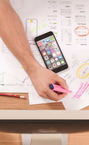 Marketer planning a strategy on paper